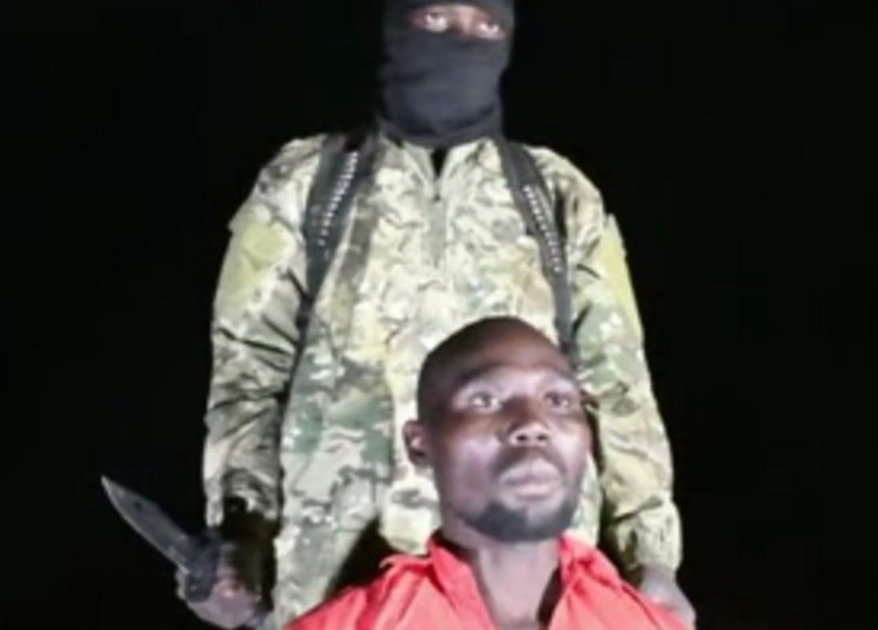 Pastor Bulus Yikura in the hand of the terrorist